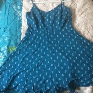 Short blue summer dress with a flower pattern